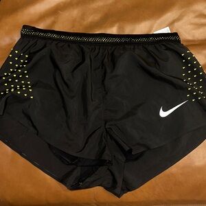 Nike Black Athletic Shorts with Yellow Accents